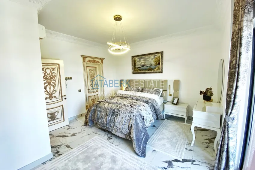 Приобрести Видовой двухуровневый пентхаус с авторским интерьером в районе Махмутлар 43 