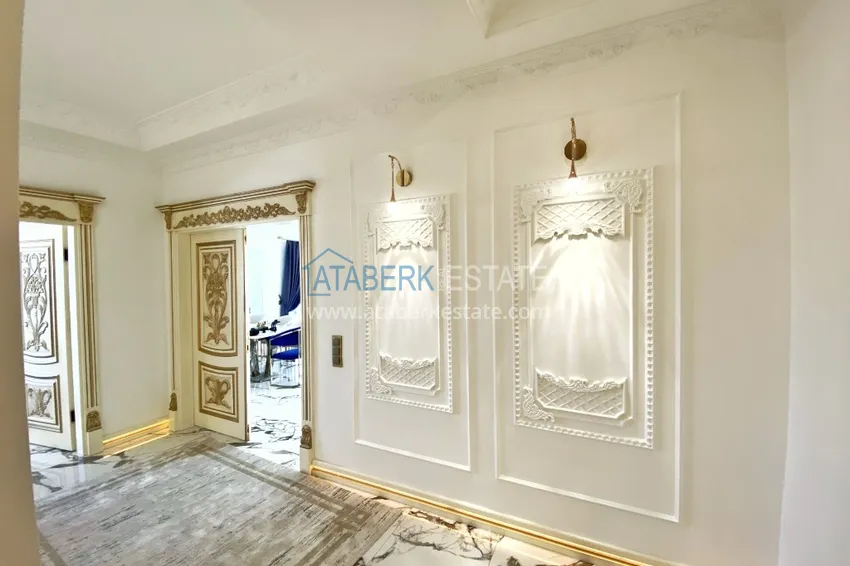 Приобрести Видовой двухуровневый пентхаус с авторским интерьером в районе Махмутлар 3 