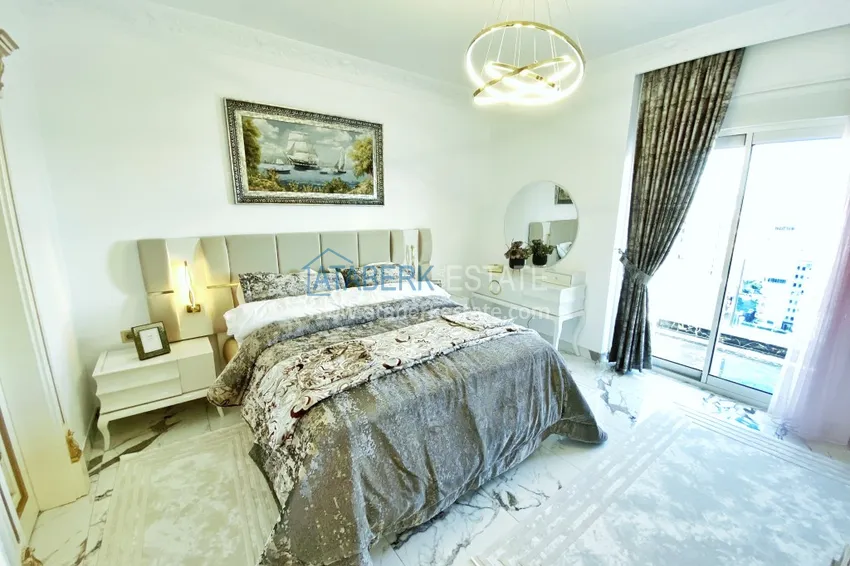 Приобрести Видовой двухуровневый пентхаус с авторским интерьером в районе Махмутлар 44 