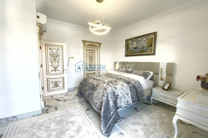 Приобрести Видовой двухуровневый пентхаус с авторским интерьером в районе Махмутлар 45 