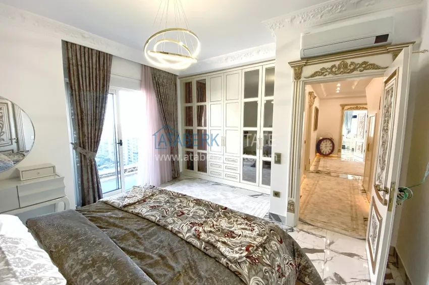 Приобрести Видовой двухуровневый пентхаус с авторским интерьером в районе Махмутлар 47 