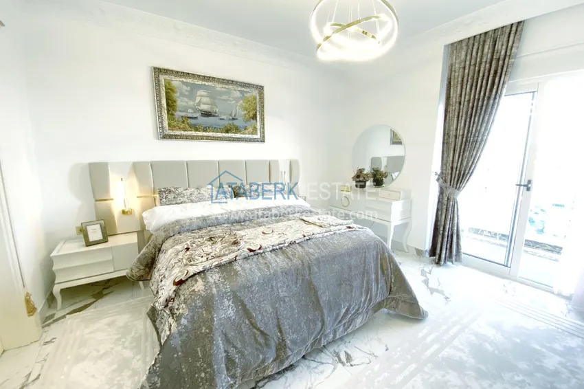 Приобрести Видовой двухуровневый пентхаус с авторским интерьером в районе Махмутлар 48 