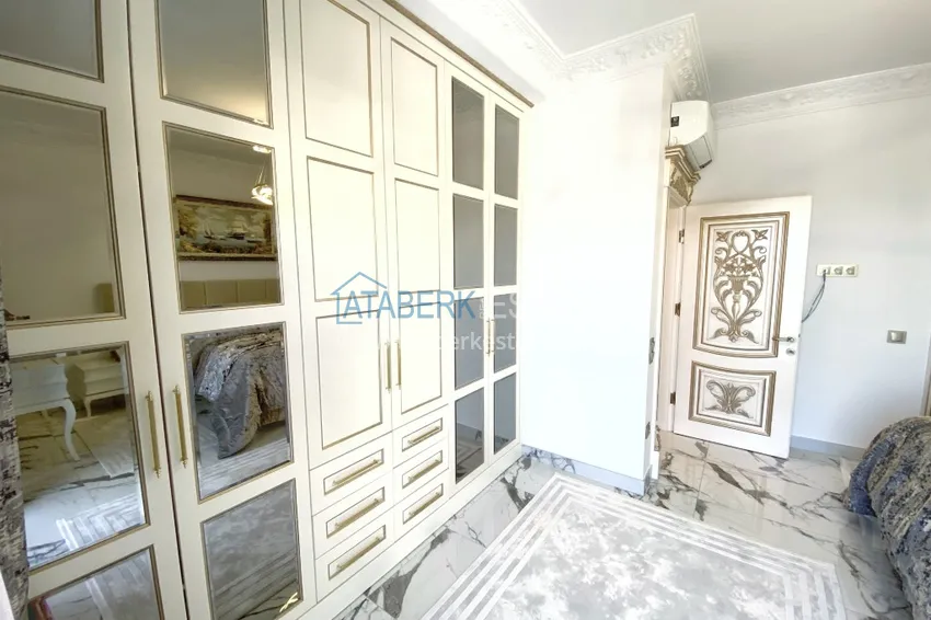 Приобрести Видовой двухуровневый пентхаус с авторским интерьером в районе Махмутлар 49 