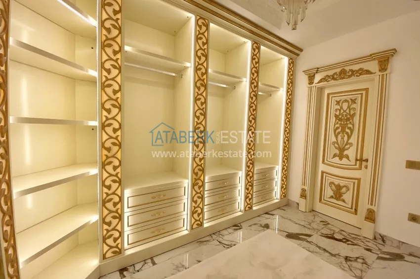 Приобрести Видовой двухуровневый пентхаус с авторским интерьером в районе Махмутлар 50 