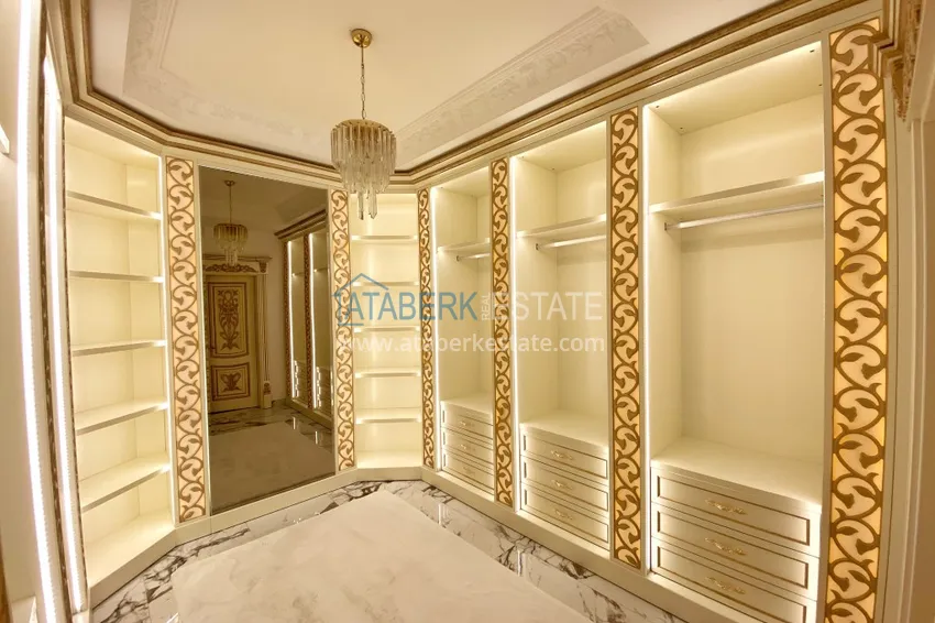 Приобрести Видовой двухуровневый пентхаус с авторским интерьером в районе Махмутлар 51 