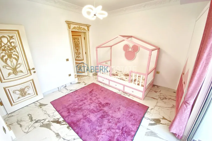 Приобрести Видовой двухуровневый пентхаус с авторским интерьером в районе Махмутлар 52 