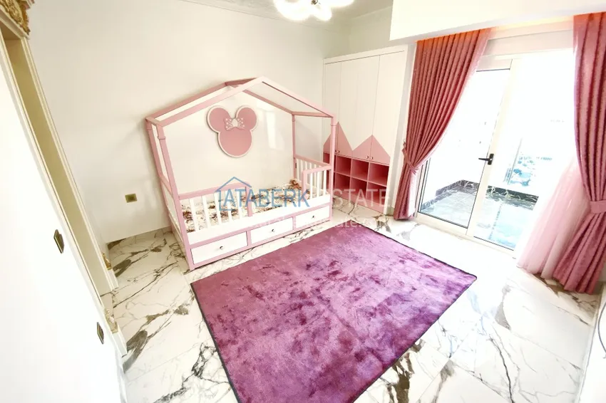 Приобрести Видовой двухуровневый пентхаус с авторским интерьером в районе Махмутлар 53 