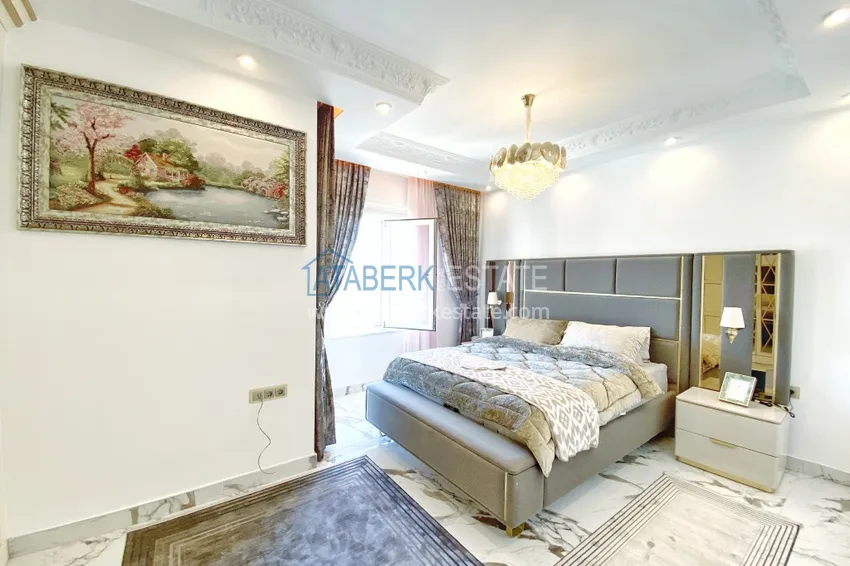 Приобрести Видовой двухуровневый пентхаус с авторским интерьером в районе Махмутлар 54 