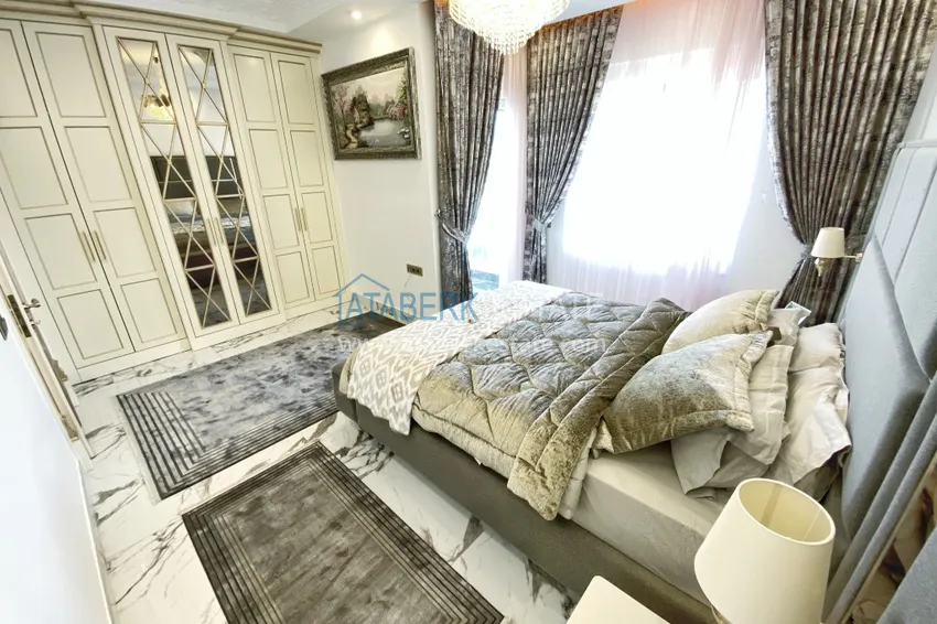 Приобрести Видовой двухуровневый пентхаус с авторским интерьером в районе Махмутлар 55 