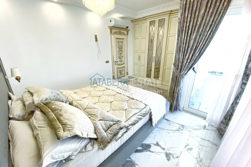 Приобрести Видовой двухуровневый пентхаус с авторским интерьером в районе Махмутлар 56 