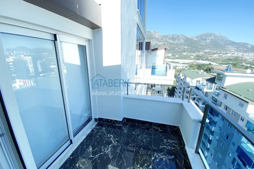 Приобрести Видовой двухуровневый пентхаус с авторским интерьером в районе Махмутлар 57 