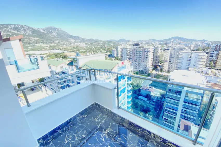 Приобрести Видовой двухуровневый пентхаус с авторским интерьером в районе Махмутлар 59 