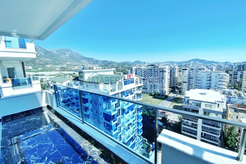 Приобрести Видовой двухуровневый пентхаус с авторским интерьером в районе Махмутлар 60 