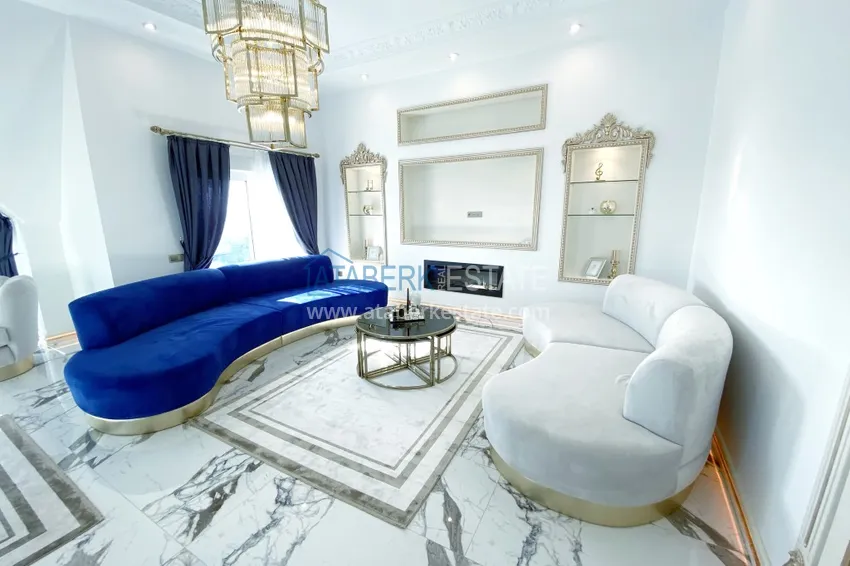 Приобрести Видовой двухуровневый пентхаус с авторским интерьером в районе Махмутлар 5 