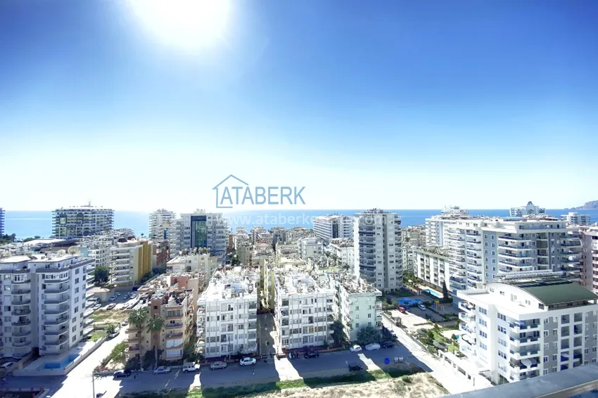 Приобрести Видовой двухуровневый пентхаус с авторским интерьером в районе Махмутлар 65 