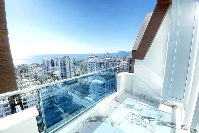 Приобрести Видовой двухуровневый пентхаус с авторским интерьером в районе Махмутлар 67 