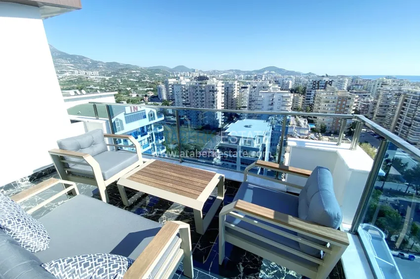 Приобрести Видовой двухуровневый пентхаус с авторским интерьером в районе Махмутлар 68 