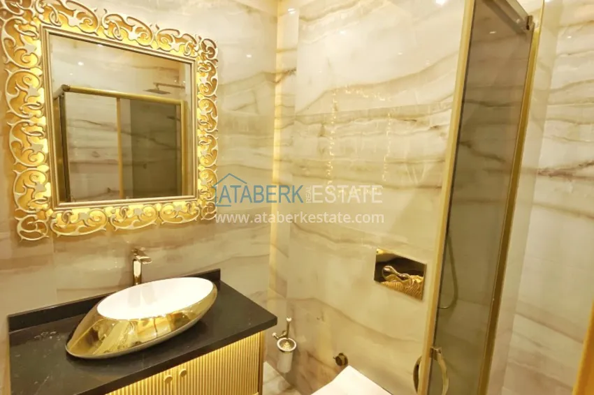 Приобрести Видовой двухуровневый пентхаус с авторским интерьером в районе Махмутлар 69 