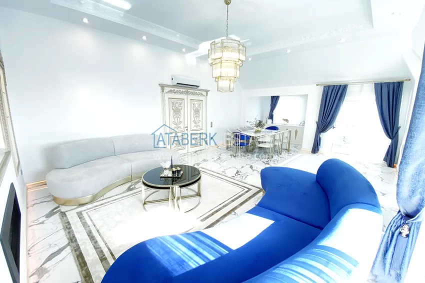 Приобрести Видовой двухуровневый пентхаус с авторским интерьером в районе Махмутлар 7 