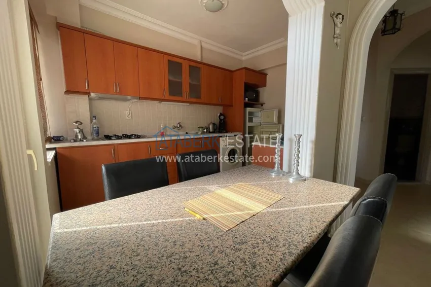 Приобрести Трехкомнатная квартира с мебелью на второй береговой линии в Махмутларе, Алания, 100 м2 12 