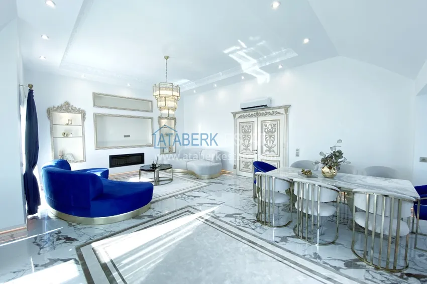 Приобрести Видовой двухуровневый пентхаус с авторским интерьером в районе Махмутлар 9 