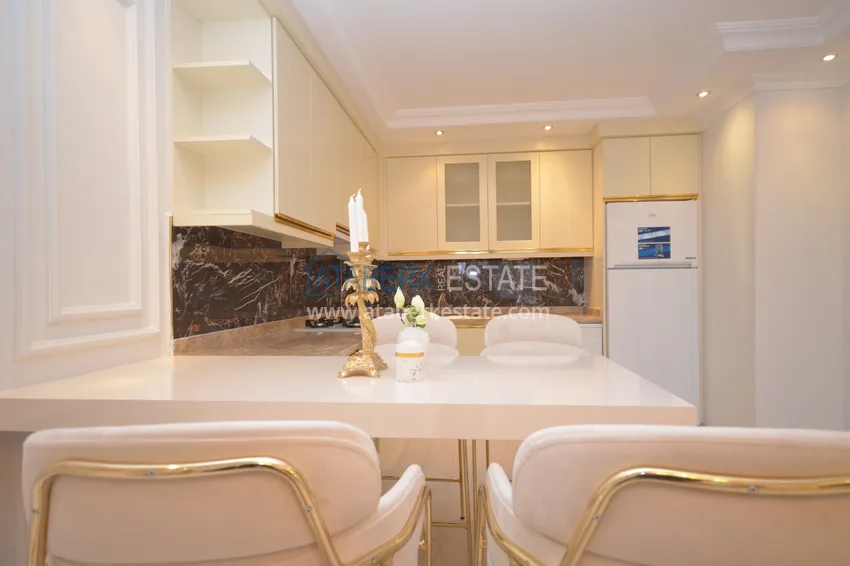 Приобрести Квартира в Махмутларе со стильным современным интерьером  12 