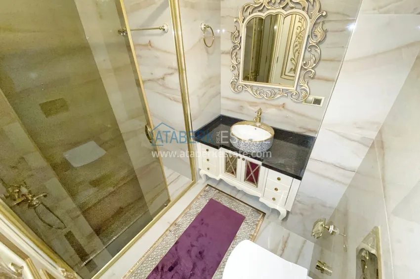 Приобрести Видовой двухуровневый пентхаус с авторским интерьером в районе Махмутлар 72 