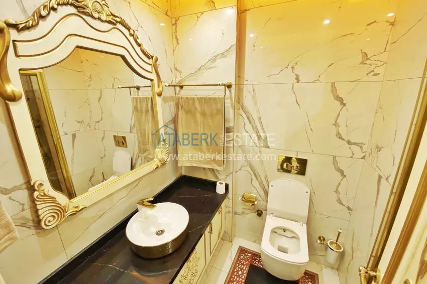 Приобрести Видовой двухуровневый пентхаус с авторским интерьером в районе Махмутлар 74 