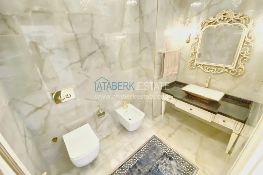 Приобрести Видовой двухуровневый пентхаус с авторским интерьером в районе Махмутлар 75 