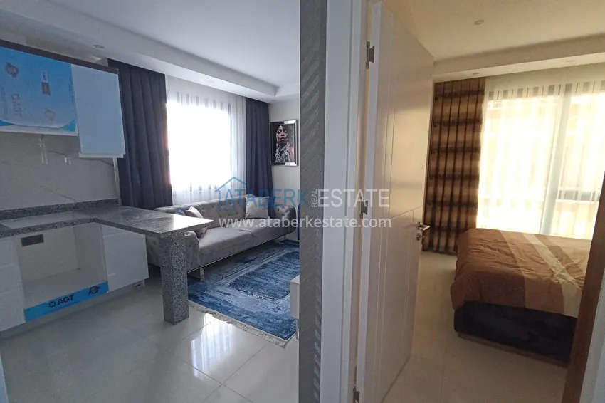 Приобрести Квартира в Махмутларе с новой мебелью, в центре района рядом с морем 1 