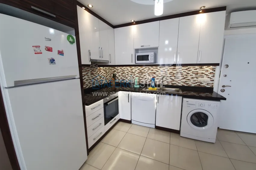 Приобрести Квартира в Махмутларе, с мебелью в комплексе класса-люкс 3 