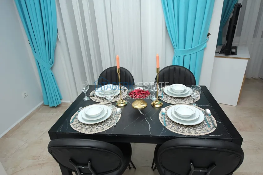 Приобрести Квартира в Махмутларе с мебелью и видом на море и горы в жилом комплексе 8 