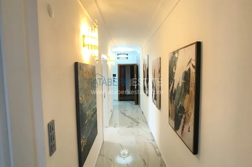 Приобрести Квартира в Махмутларе с дизайнерским интерьером и прямым видом на море  1 