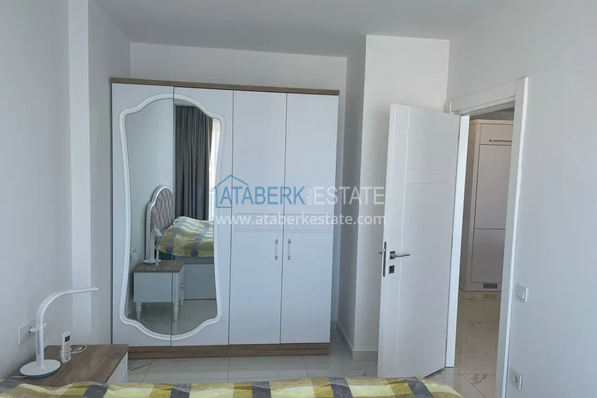 Приобрести Квартира в Махмутлар с мебелью, застекленным балконом и видом на море  12 