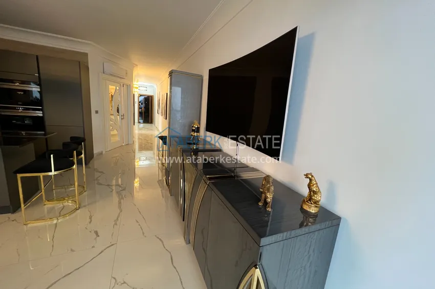 Приобрести Квартира в Махмутларе с дизайнерским интерьером и прямым видом на море  12 