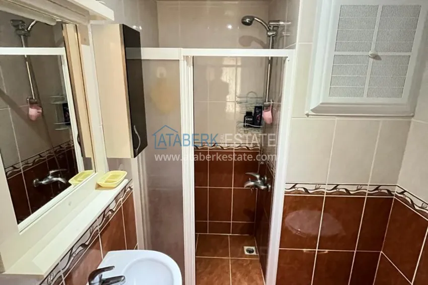 Приобрести Квартира в районе Махмутлар с мебелью и видом на море в жилом комплексе с бассейном  14 