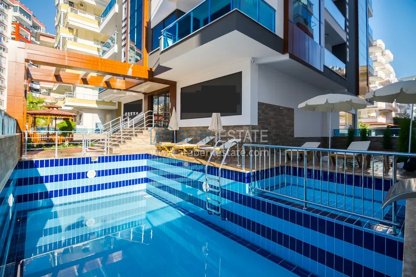 Квартира в районе Махмутлар с мебелью и застекленными балконами в новом комплексе 12 