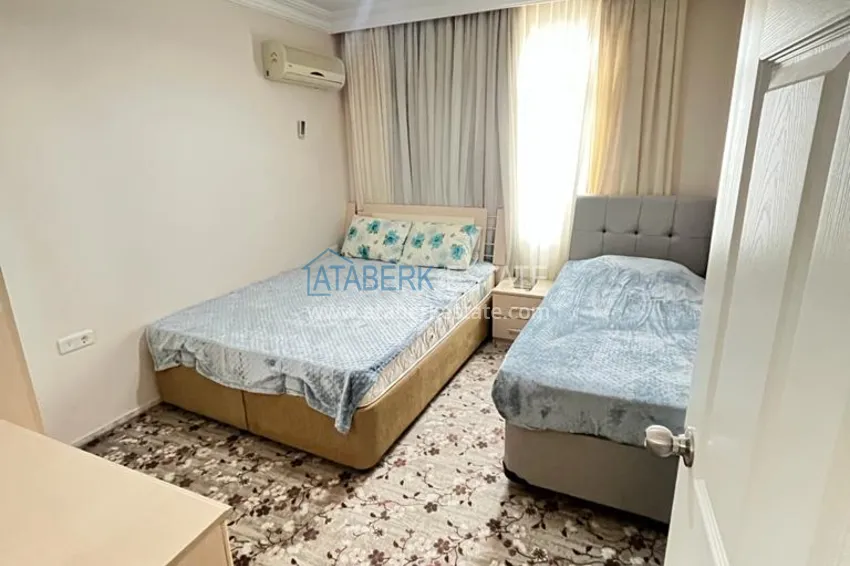 Приобрести Квартира в районе Махмутлар с мебелью и видом на море в жилом комплексе с бассейном  15 