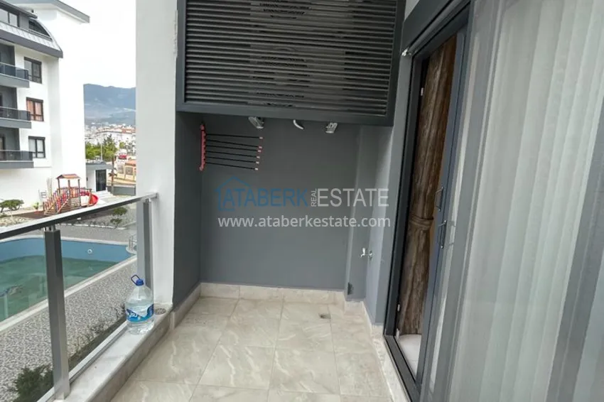 Приобрести Квартира в районе Оба двухкомнатная с мебелью в уютном жилом комплексе 13 