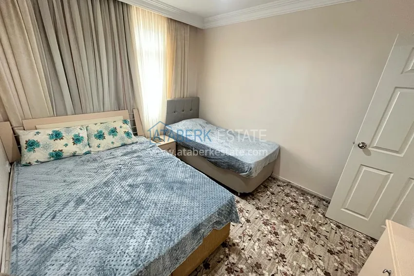 Приобрести Квартира в районе Махмутлар с мебелью и видом на море в жилом комплексе с бассейном  16 