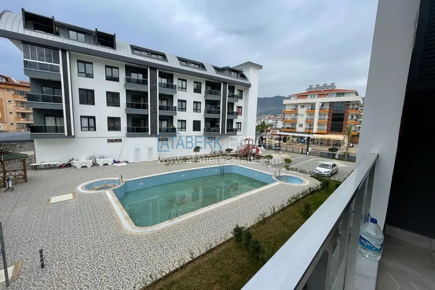 Приобрести Квартира в районе Оба двухкомнатная с мебелью в уютном жилом комплексе 14 