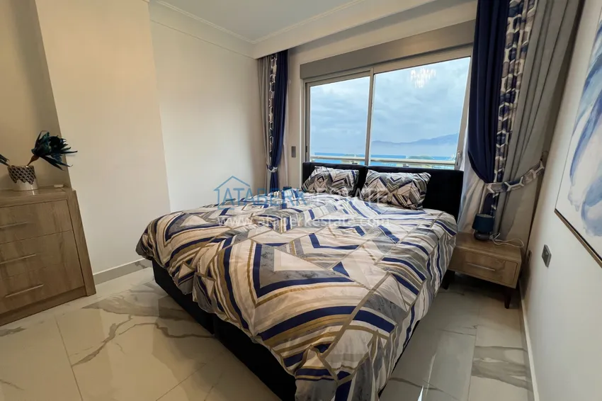 Приобрести Квартира в Махмутларе с дизайнерским интерьером и прямым видом на море  23 