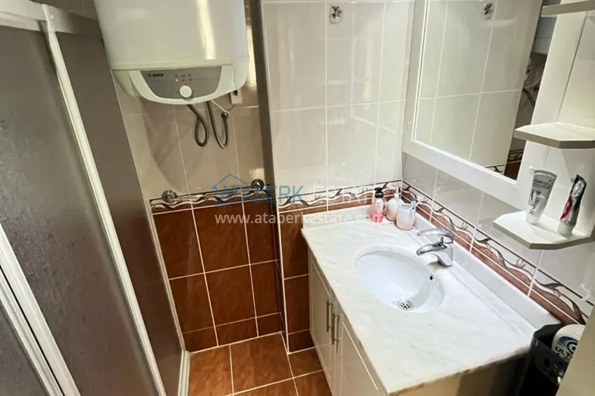 Приобрести Квартира в районе Махмутлар с мебелью и видом на море в жилом комплексе с бассейном  19 