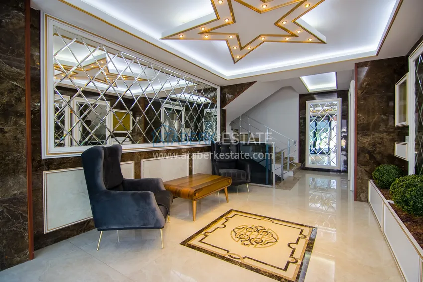 Квартира в районе Махмутлар с мебелью и застекленными балконами в новом комплексе 19 