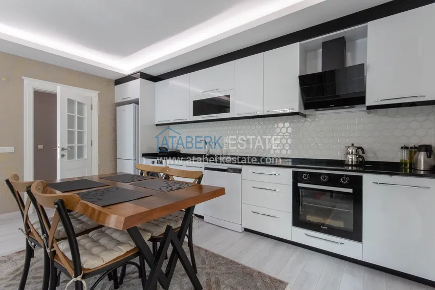 Приобрести Квартира в районе Махмутлар с мебелью и застекленными балконами в новом комплексе 5 