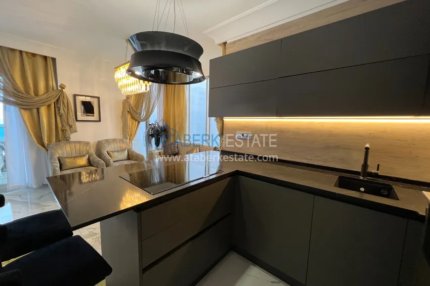 Приобрести Квартира в Махмутларе с дизайнерским интерьером и прямым видом на море  8 