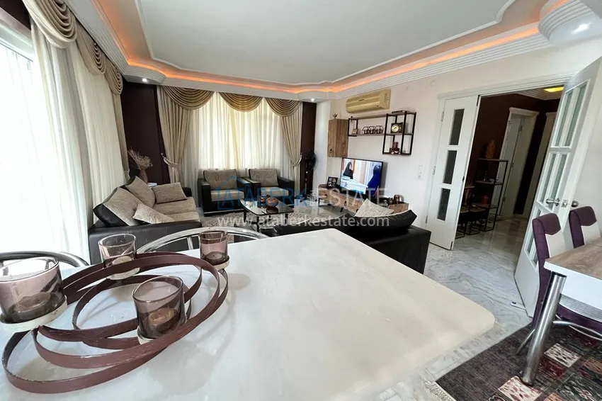 Приобрести Квартира в районе Махмутлар с мебелью и видом на море в жилом комплексе с бассейном  7 