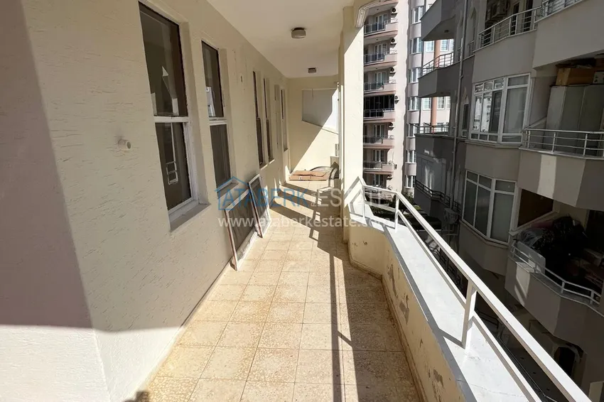 Приобрести Квартира в Махмутларе трехкомнатная в жилом комплексе рядом с морем 9 