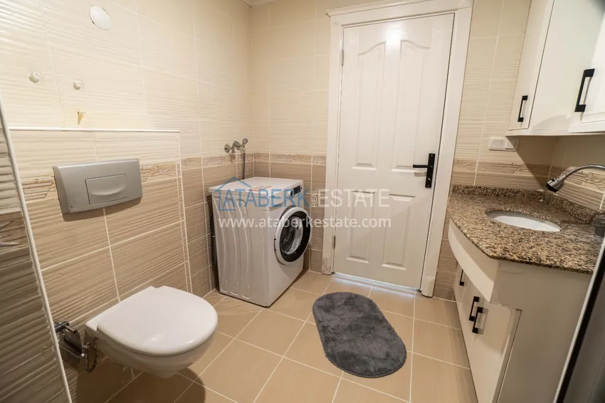 Приобрести Квартира в Махмутларе с мебелью и видом на горы в благоустроенном комплексе 12 