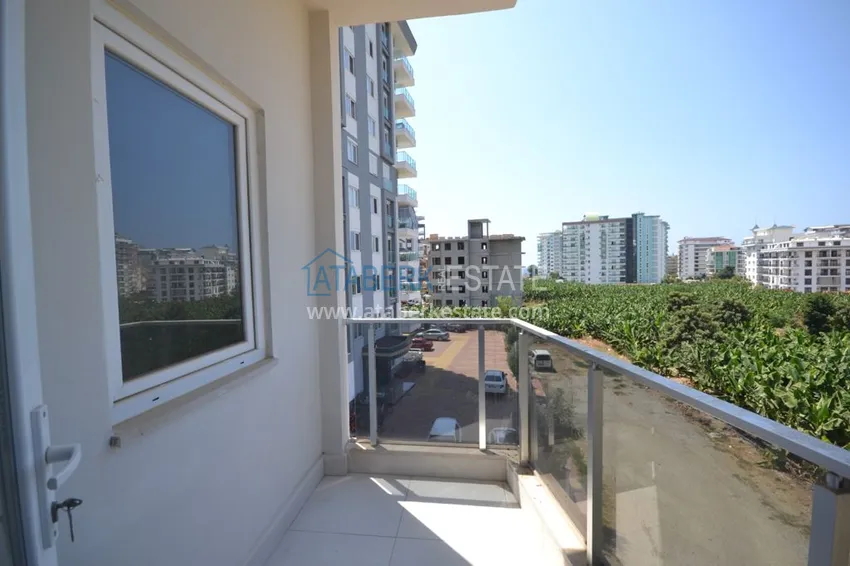 Приобрести Квартира в Махмутларе двухкомнатная с чистовой отделкой. Новостройки Алании 12 